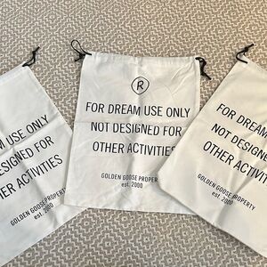 Golden Goose White Drawstring Bags with Black Text